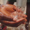 childs hands running water outside credit kelly l from pexels 856x640
